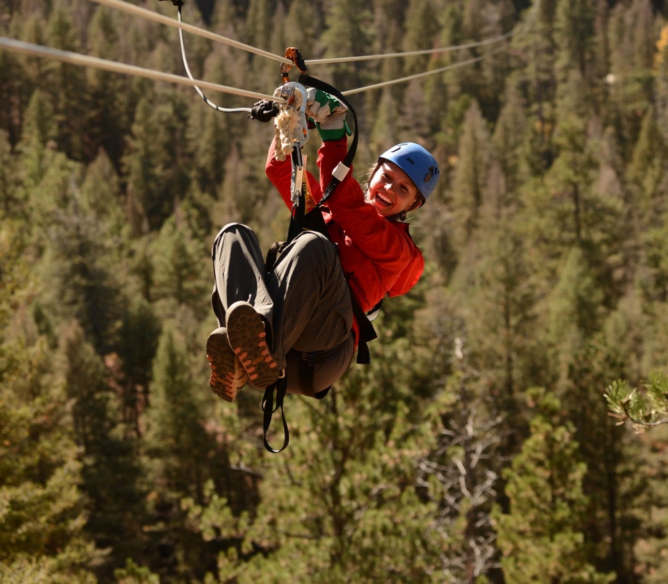 A woman ziplining at Soaring Adventures