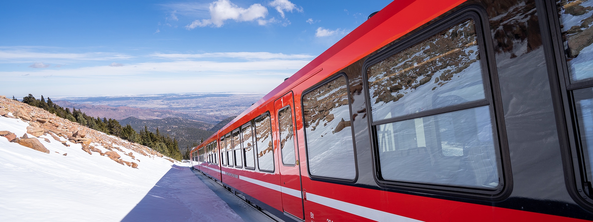 Red Train On Snowy Mountain